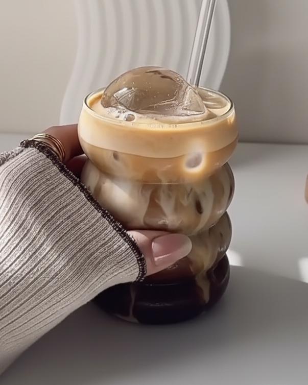 Starlight Express bubble glass coffee mug with straw, clear iced coffee cup for kitchen and dining use, featuring a textured bubble design.