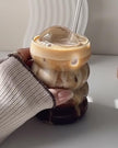 Starlight Express bubble glass coffee mug with straw, clear iced coffee cup for kitchen and dining use, featuring a textured bubble design.