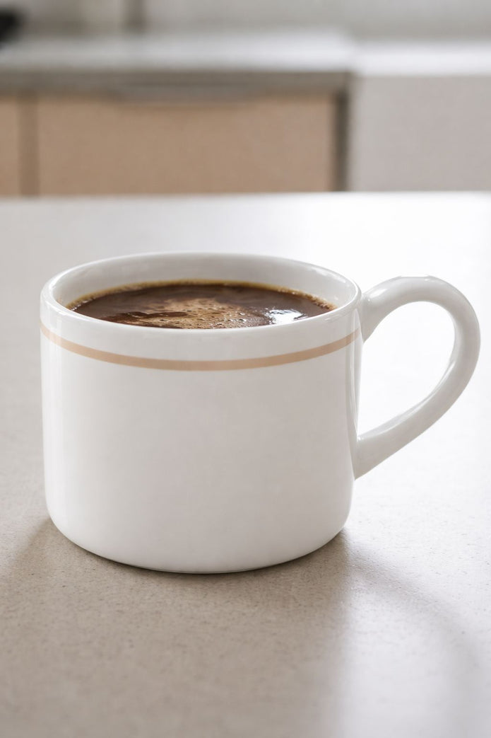 White organic Delilah mug by Coach House, featuring a simple ceramic design perfect for kitchen and dining use.
