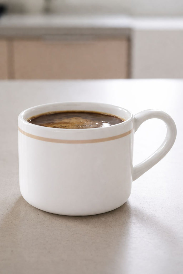 White organic Delilah mug by Coach House, ceramic kitchen and dining mug with a smooth finish and ergonomic handle.