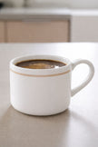 White organic Delilah mug by Coach House, ceramic kitchen and dining mug with a smooth finish and ergonomic handle.
