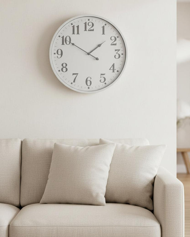 White round Aubrey wall clock by Hill Interiors, featuring a sleek modern design with black hour and minute hands.