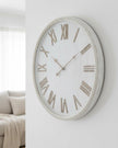 Large rustic white clock with beaded frame from Hill Interiors, featuring a vintage-style design and classic round shape.
