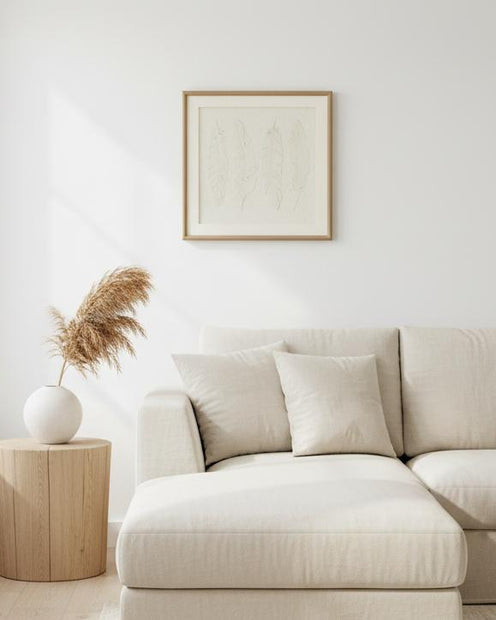 Alta White Feather wall art in a frame by Hill Interiors, featuring delicate white feathers for elegant home decor.