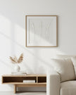 White feather wall art by Hill Interiors in a frame, suitable for decorating modern interior spaces.