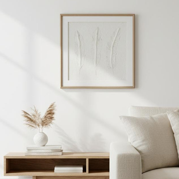 White feather wall art by Hill Interiors in a frame, suitable for decorating modern interior spaces.