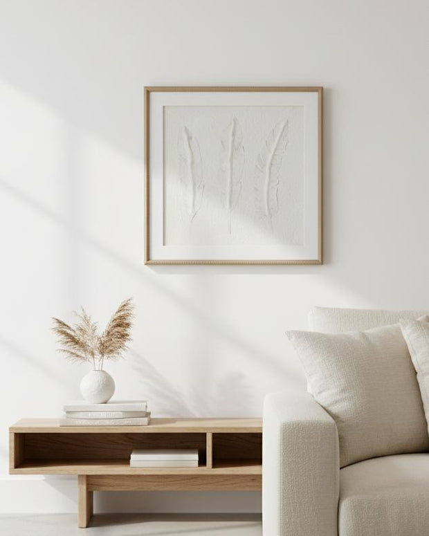 White feather wall art by Hill Interiors in a frame, suitable for decorating modern interior spaces.