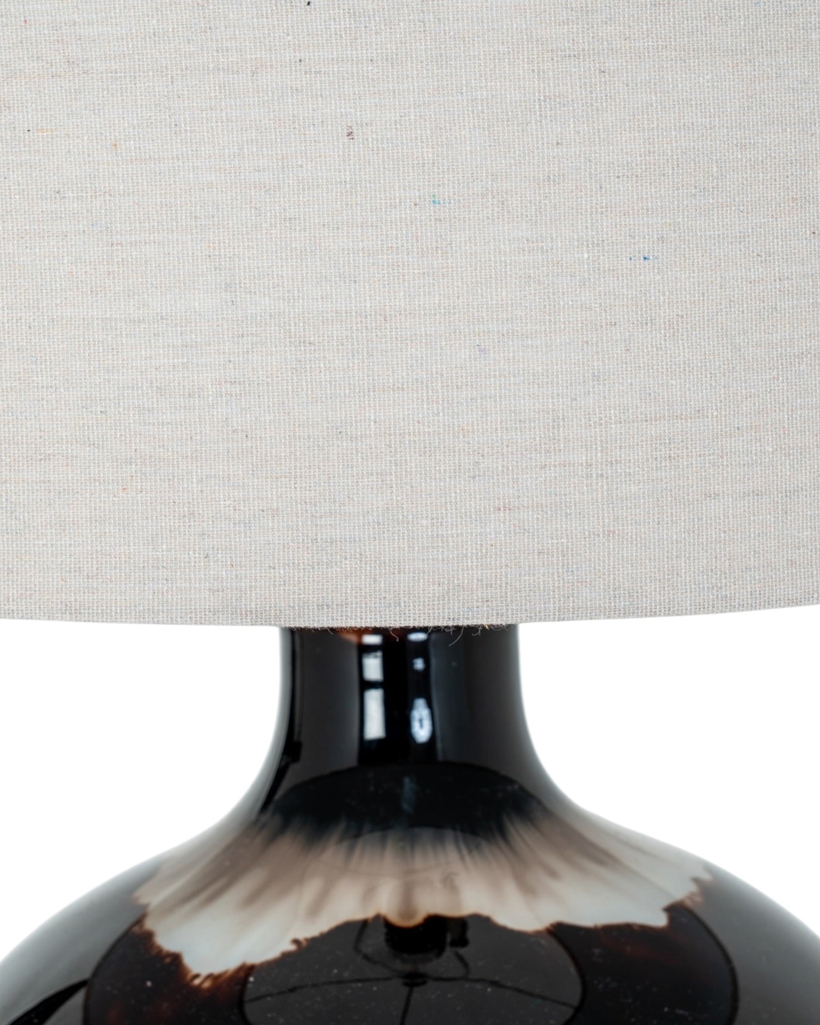 Chocolate brown glass lamp from Hill Interiors, showcasing a stylish lighting fixture with a smooth glass finish and modern design.