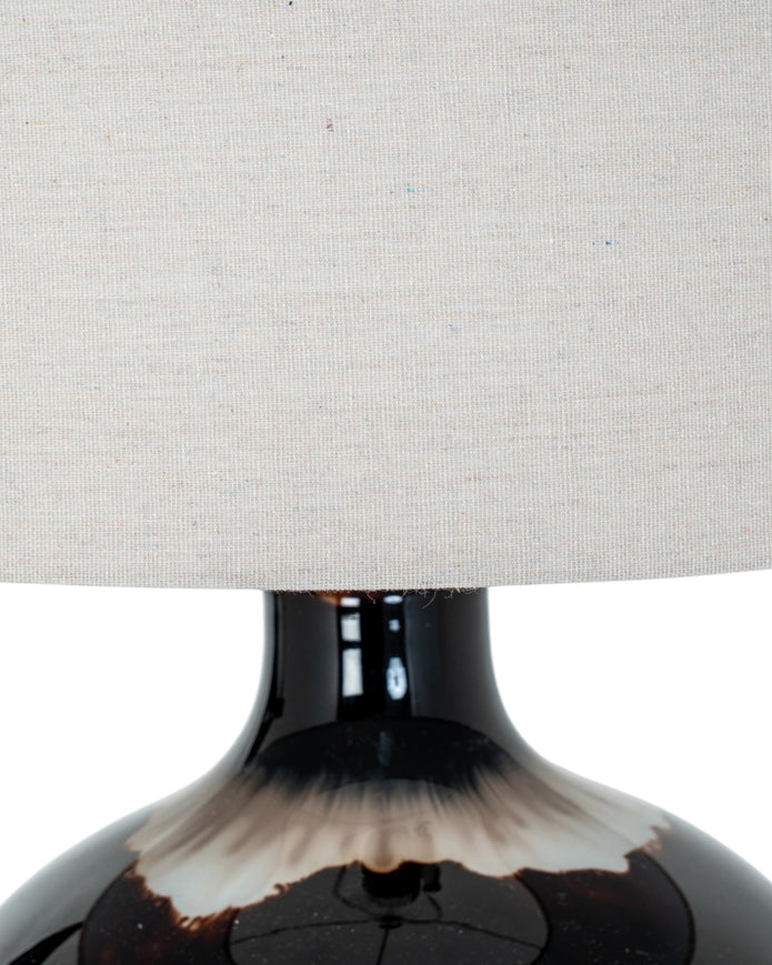 Chocolate brown glass lamp from Hill Interiors, showcasing a stylish lighting fixture with a smooth glass finish and modern design.