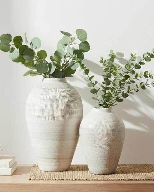 White glazed Kemi Olpe vase by Hill Interiors, showcasing its smooth surface and elegant shape on a neutral background.