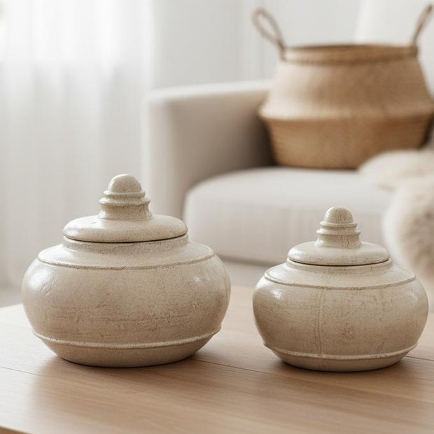 Tarn Neutral glazed lidded vase from Hill Interiors, ceramic with a smooth finish, featuring a rounded shape and lid.