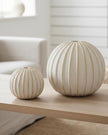Decorative globe striped ball for home décor by Hill Interiors, featuring colorful, textured design for stylish interior accents.