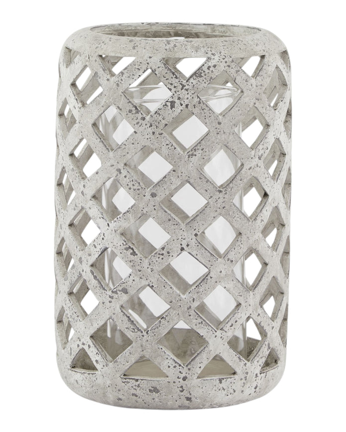 Stone lattice hurricane lantern for home decor by Hill Interiors, featuring a textured stone exterior and glass interior for ambient lighting.