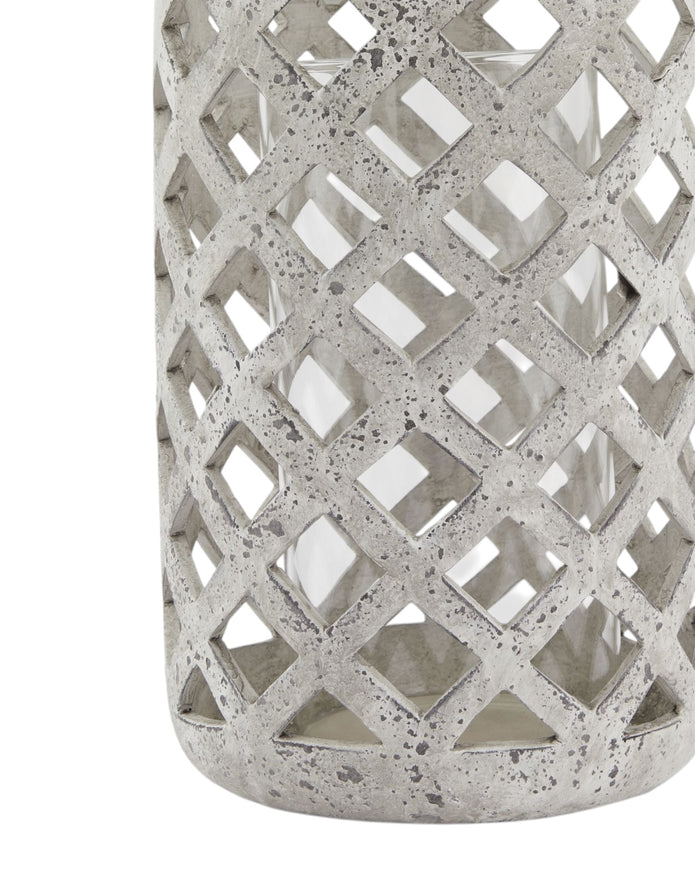 Stone lattice hurricane lantern for home decor, featuring intricate stone detailing and a glass enclosure for candle display.