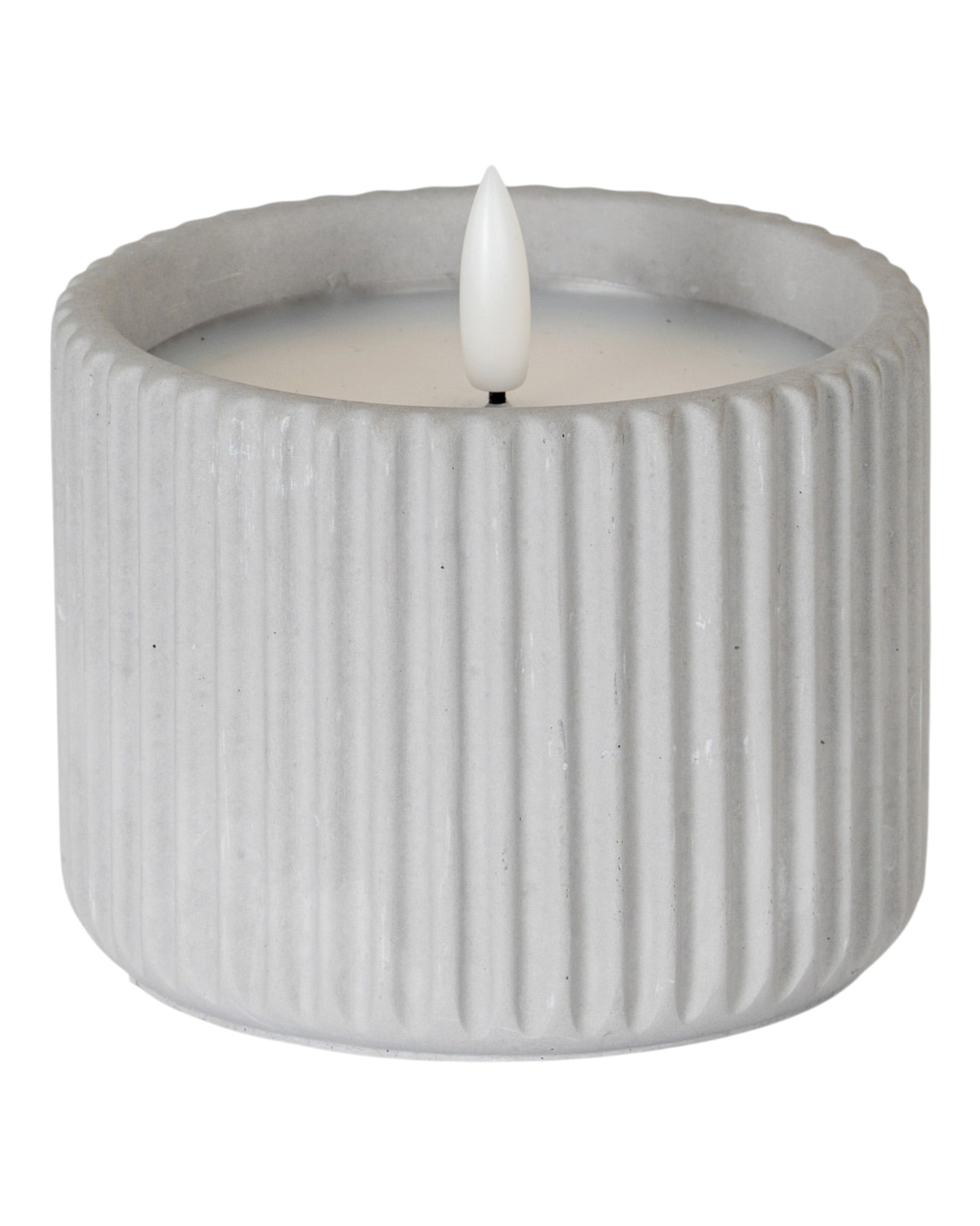 Natural Stone Ribbed Light Up LED Candle for home decor by Hill Interiors, glowing with a warm, ambient light.