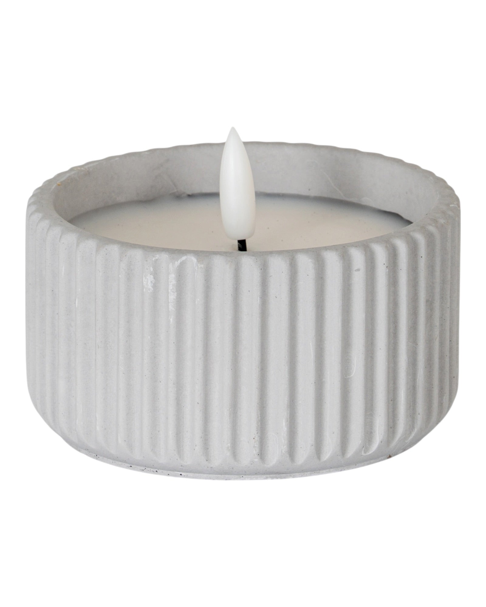 Natural stone ribbed LED candle for home decor, illuminated with soft light, by Hill Interiors.
