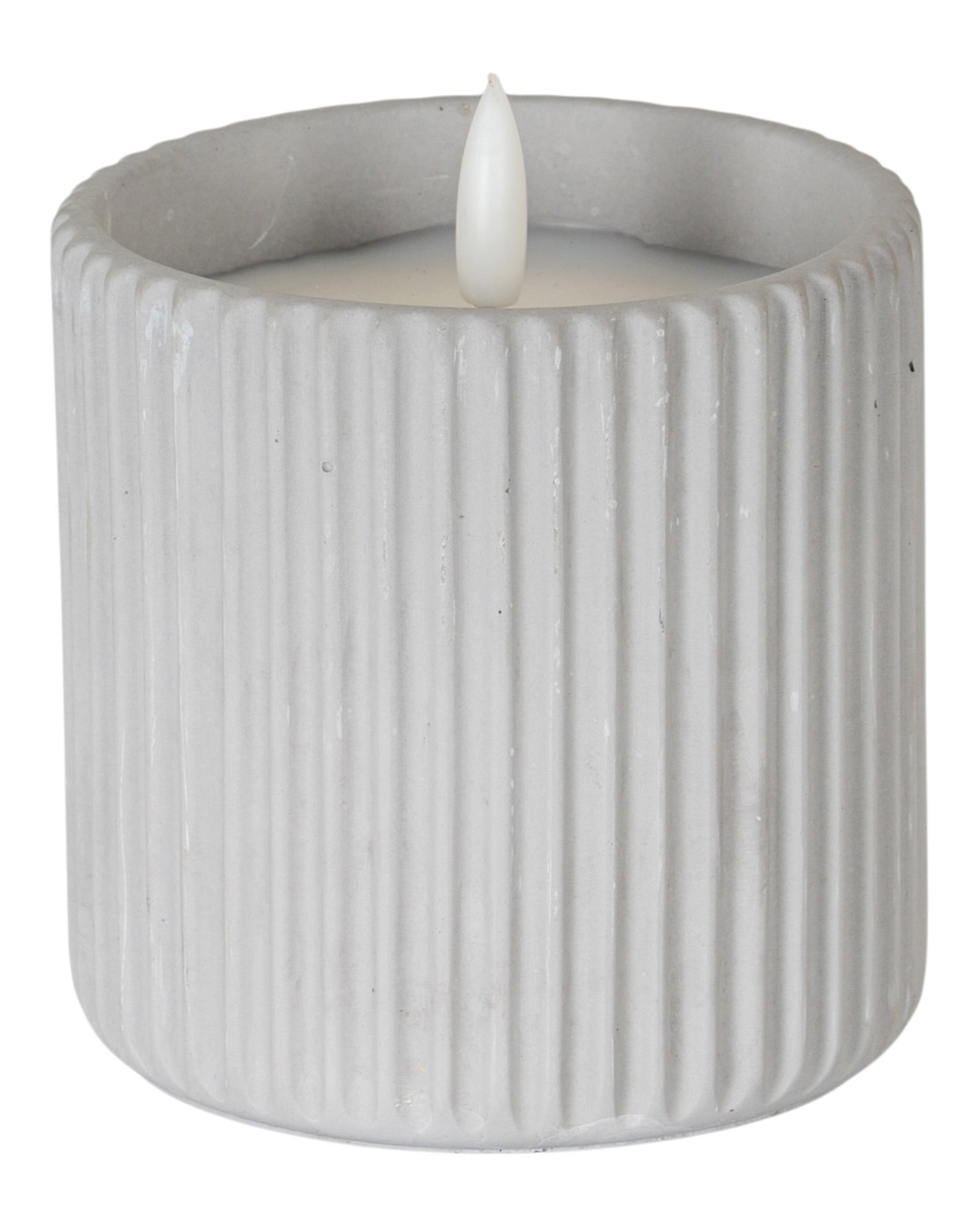Natural stone ribbed LED candle for home decor by Hill Interiors, illuminated with a soft, warm glow in a stylish design.