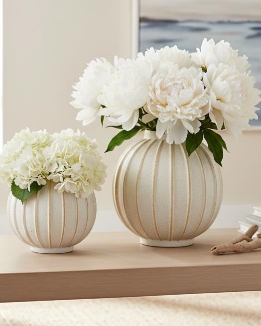 Decorative vase with blue and white globe striped design by Hill Interiors, perfect for home décor accents.