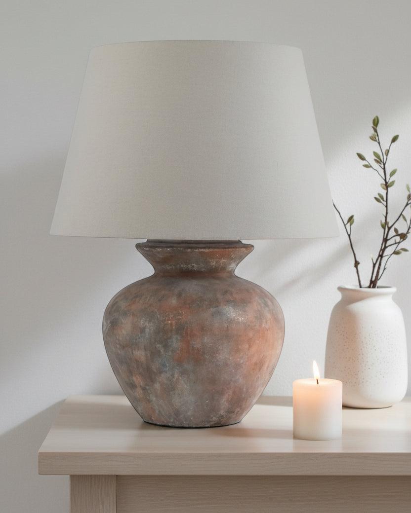 Large brown round table lamp with linen shade, perfect for home decor by Hill Interiors.