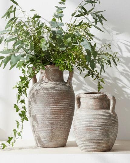 Siena Matt Brown Stone Amphora Vase by Hill Interiors, showcasing a classic, textured ceramic vase with a narrow neck and rounded body.