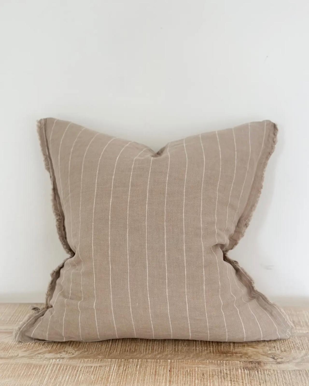 Beige narrow stripe cushion cover from Ellenvale Trade's soft furnishings collection, featuring a stylish striped design.