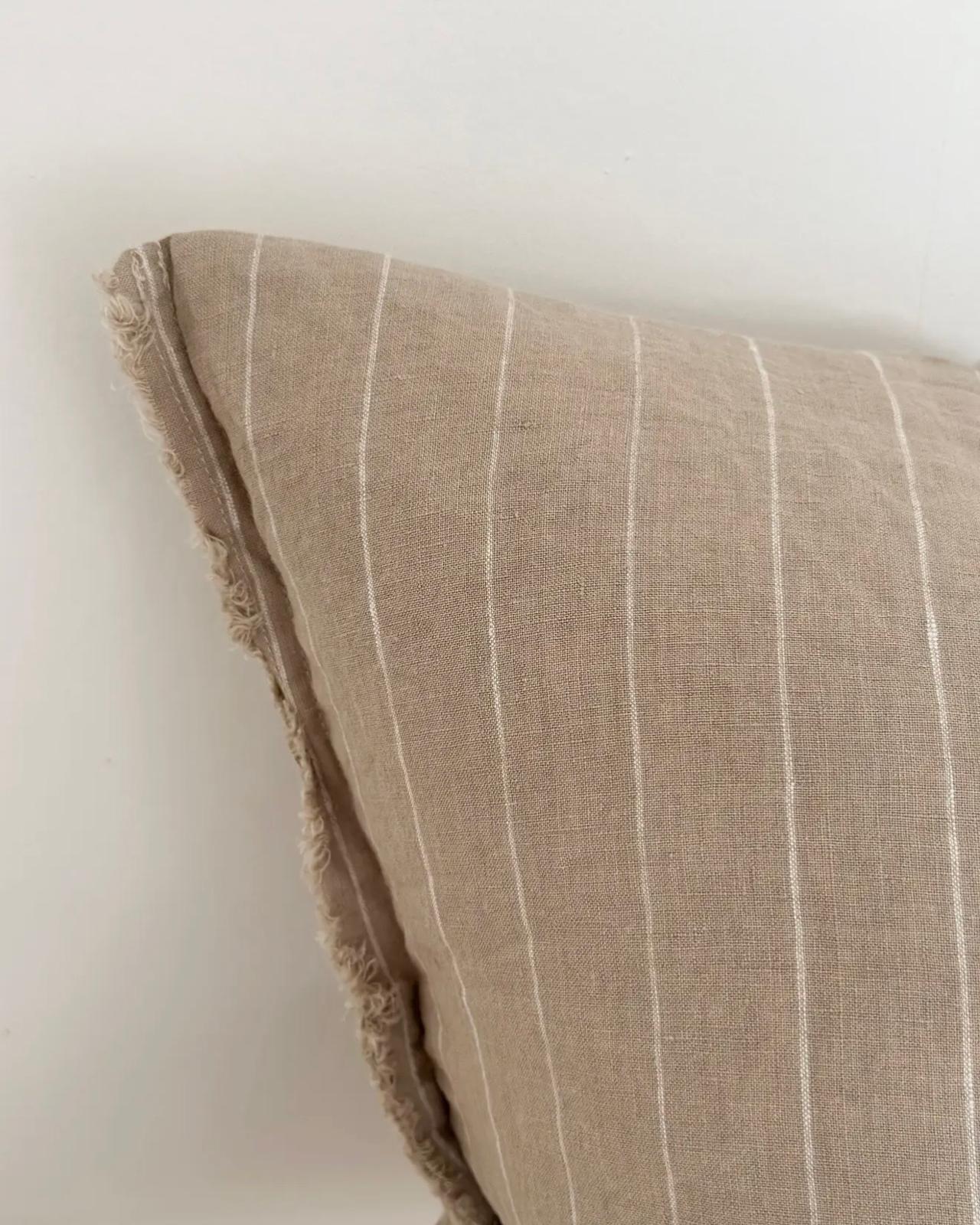 Beige narrow stripe cushion cover from Ellenvale Trade, soft furnishings, with a close-up of textured fabric and subtle stripe pattern.