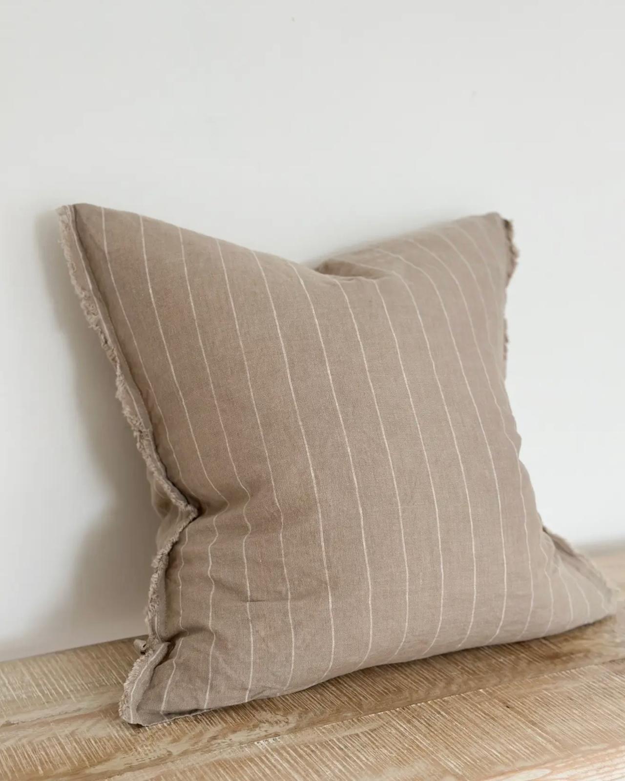 Beige narrow stripe cushion cover from Ellenvale Trade's soft furnishings collection, featuring a stylish, textured fabric design.