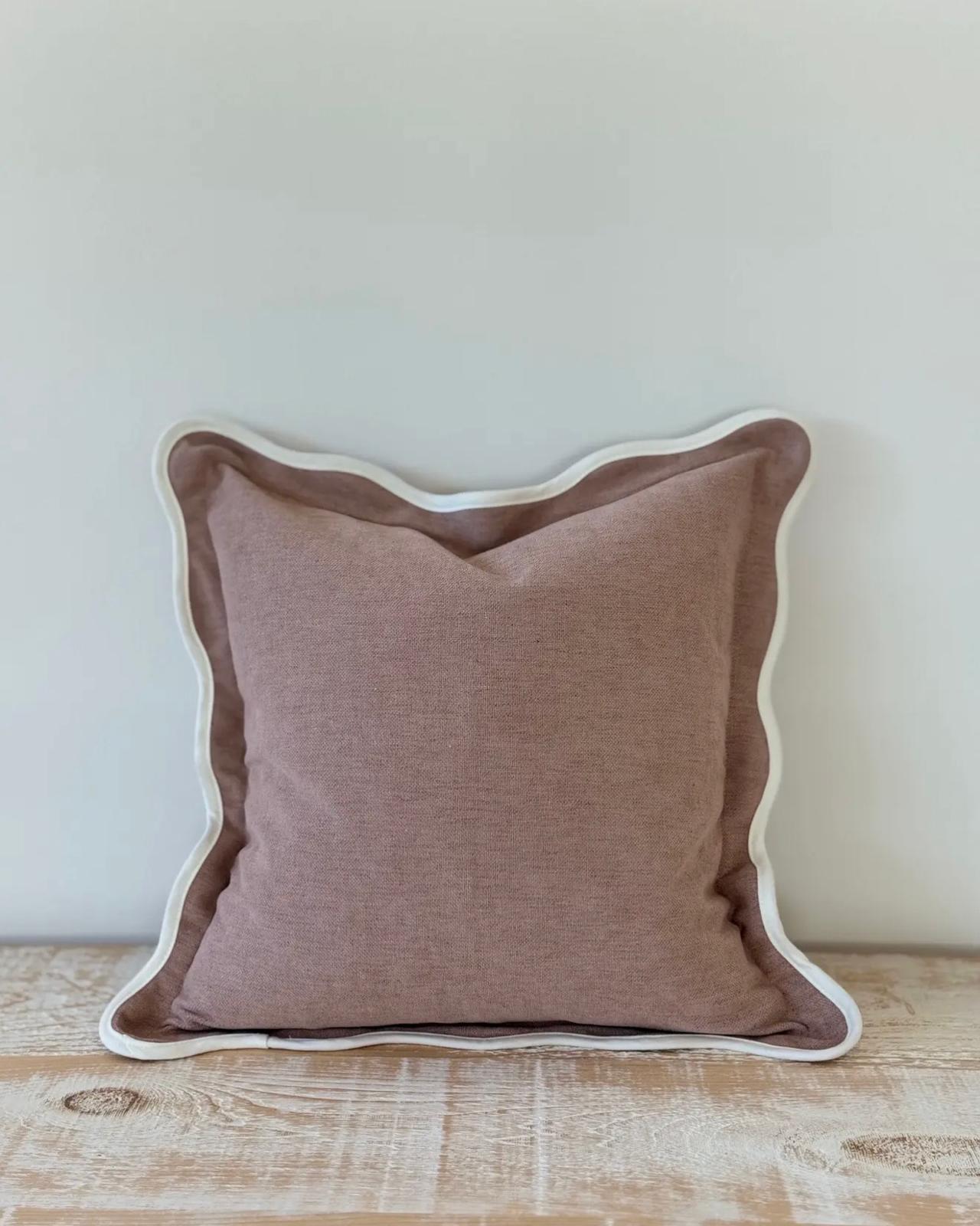 Dusty pink square scalloped cushion cover by Ellenvale Trade, soft furnishings with decorative scalloped edges.