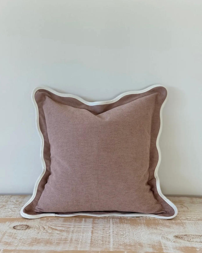 Dusty pink square scalloped cushion cover by Ellenvale Trade, soft furnishings with decorative scalloped edges.