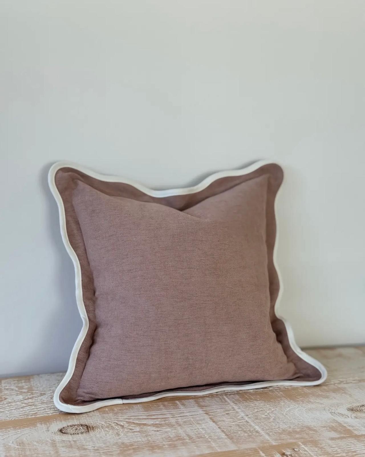 Dusty pink Chloe square scalloped cushion cover by Ellenvale Trade, soft furnishings with scalloped edges on a cushion.