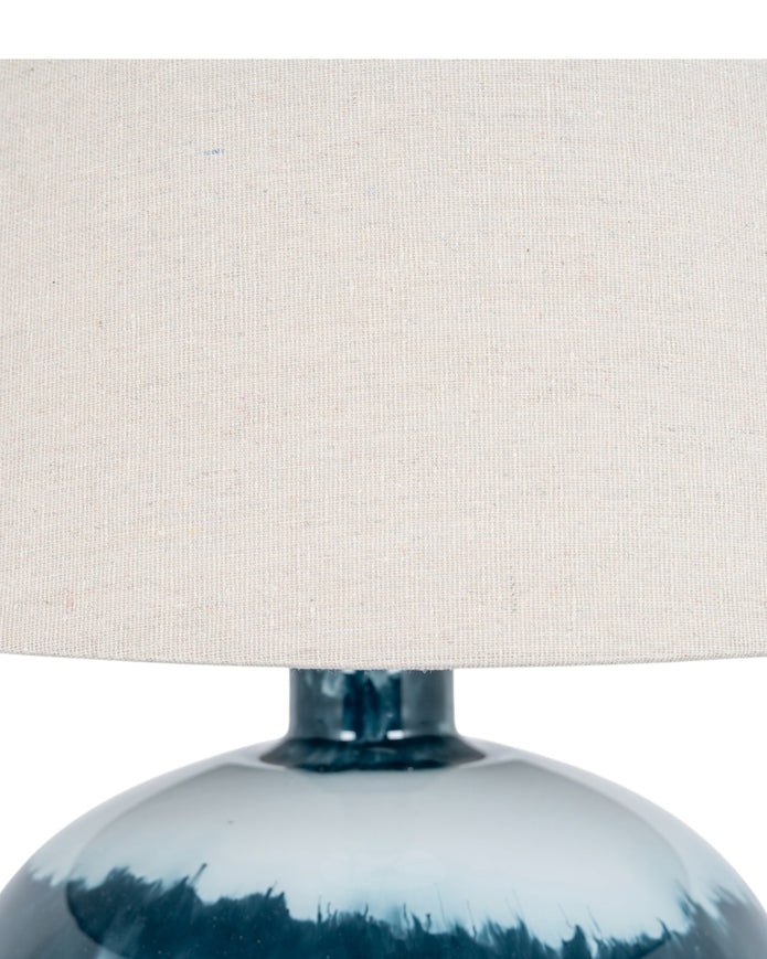Teal blue glass lamp by Hill Interiors, decorative lighting fixture with a smooth, rounded glass shade on a sleek base.