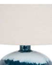 Teal blue glass lamp by Hill Interiors, decorative lighting fixture with a smooth, rounded glass shade on a sleek base.