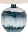Teal blue glass lamp from Hill Interiors with a sleek, modern lighting design and a smooth glass finish.