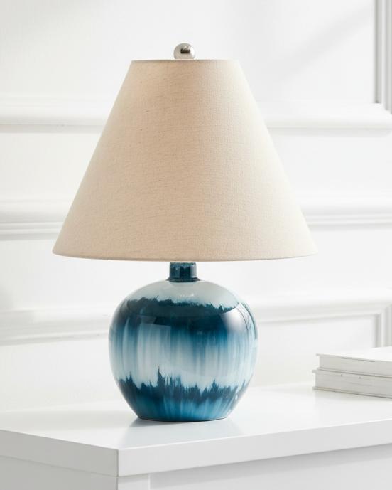 Teal blue glass lamp from Hill Interiors with a sleek lighting design and smooth glass surface.