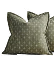 Olive green woven cushion cover with cross design from Starlight Express, soft furnishings accent for sofa or bed.