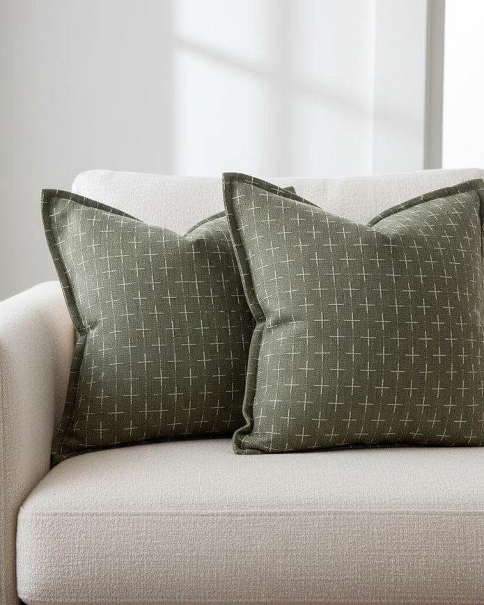 Olive green woven cushion cover with cross design from Starlight Express, soft furnishings accent for sofa or chair.