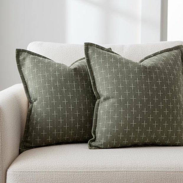 Olive green woven cushion cover with cross design from Starlight Express, soft furnishings accent for sofa or chair.
