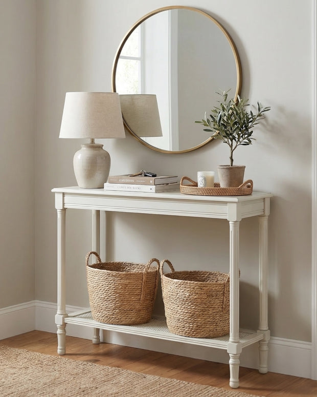 Hill Interiors Belmont Rattan Collection console table with woven rattan design and sleek wooden legs.
