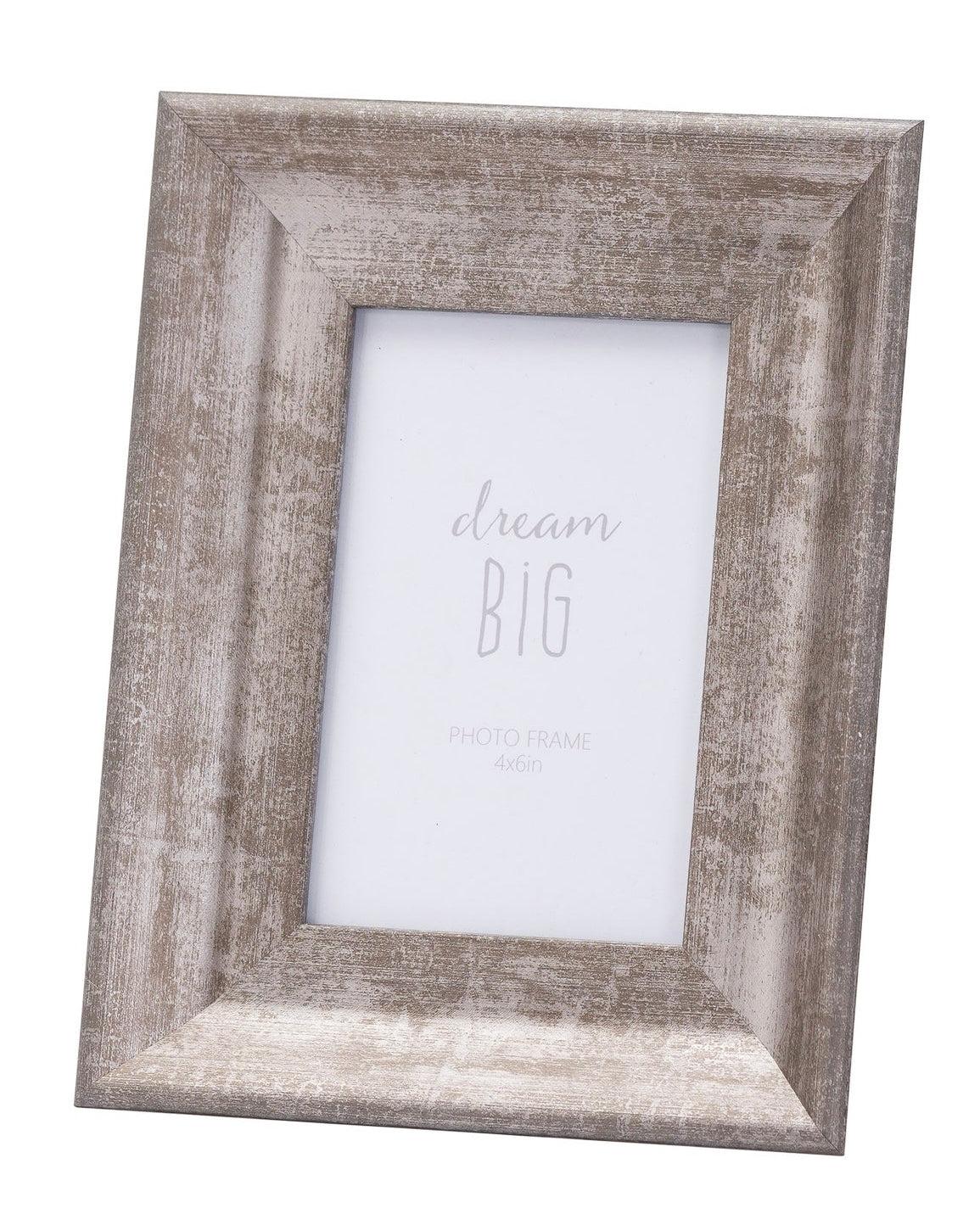 Silver wooden photo frame with a wide border, decorative design, perfect for displaying photos in a stylish setting.