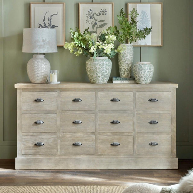 Haldon Collection 12-drawer chest by Hill Interiors with wood finish and sleek metal handles, detailed view of storage drawers.