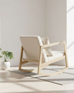 Cream boucle Sherpa rocking chair by Starlight Express with plush upholstery and wooden legs, perfect for cozy living rooms.