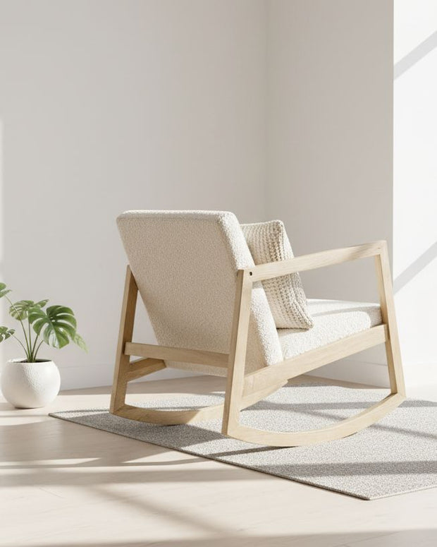 Cream boucle Sherpa rocking chair by Starlight Express with plush upholstery and wooden legs, perfect for cozy living rooms.