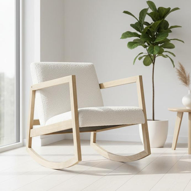 Cream boucle Sherpa rocking chair with a plush cushion and wooden rockers, styled with modern furniture design.