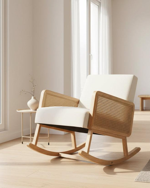 Cream rattan rocking chair by Starlight Express, showcasing a cozy, stylish furniture piece with curved armrests and a smooth rocking base.