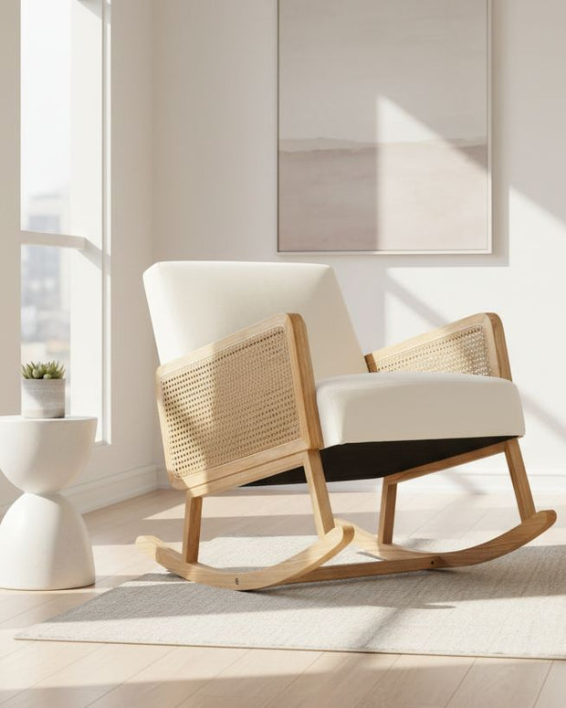 Cream rattan rocking chair from Starlight Express, showcasing a cozy, stylish furniture piece with curved armrests and a smooth rocking motion.
