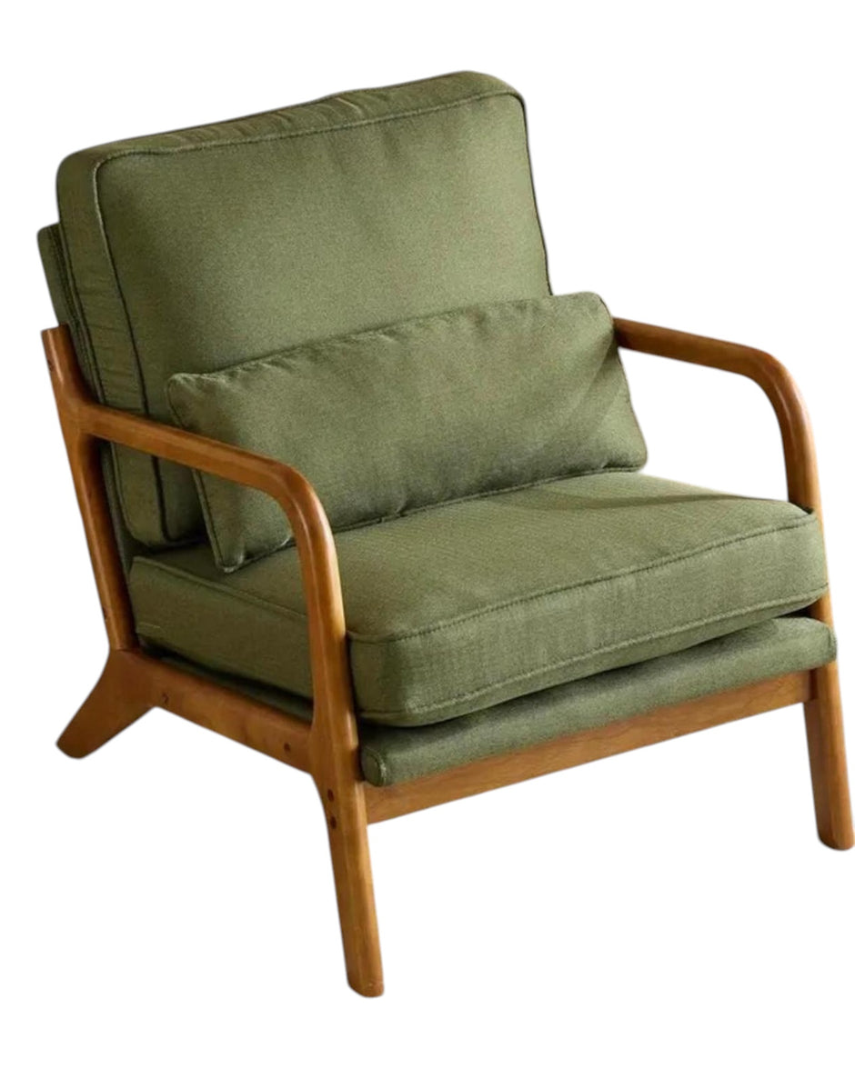 Green retro wooden framed arm chair from Starlight Express with plush upholstery and vintage design in a cozy living space.