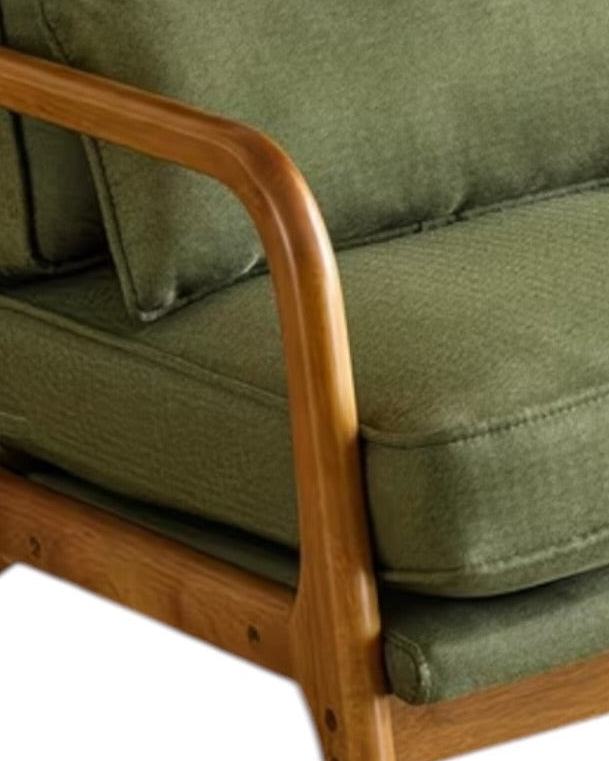 Green retro wooden framed arm chair from Starlight Express with plush cushion and vintage design, ideal for living room decor.