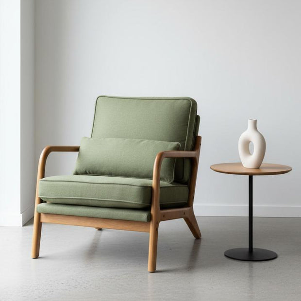 Green retro wooden framed arm chair by Starlight Express with plush cushioning and vintage design, suitable for living rooms or reading nooks.