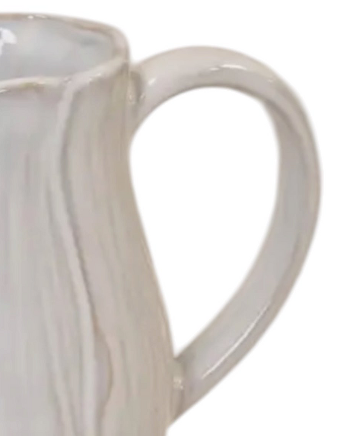 Natural ceramic jug with petal-shaped design, Satchville home decor piece featuring a smooth, elegant finish and floral-inspired shape.