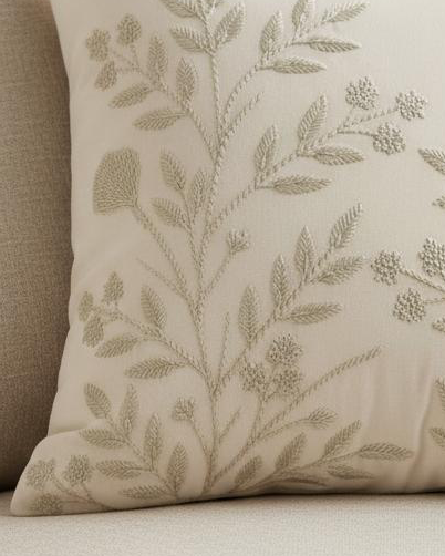 Cream floral embroidered cushion cover from Starlight Express, featuring soft furnishings with intricate floral embroidery.